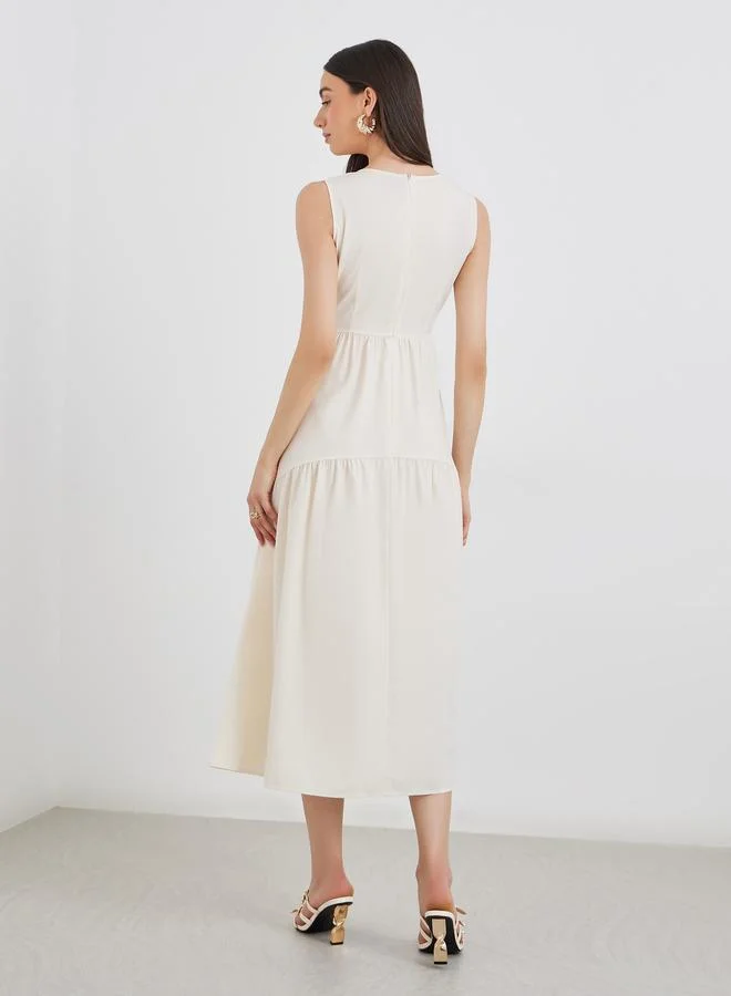 Take Two Take Two Beige Solid Sleeveless Tiered Midi Dress