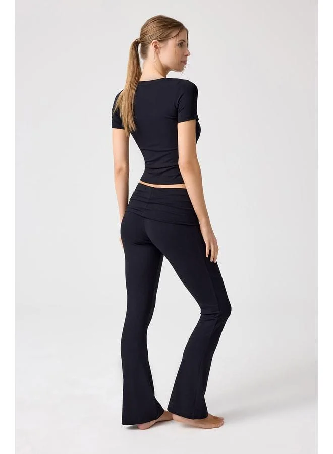 Los Ojos x Melodi Black Spanish Cuff Jersey Flared Pants.