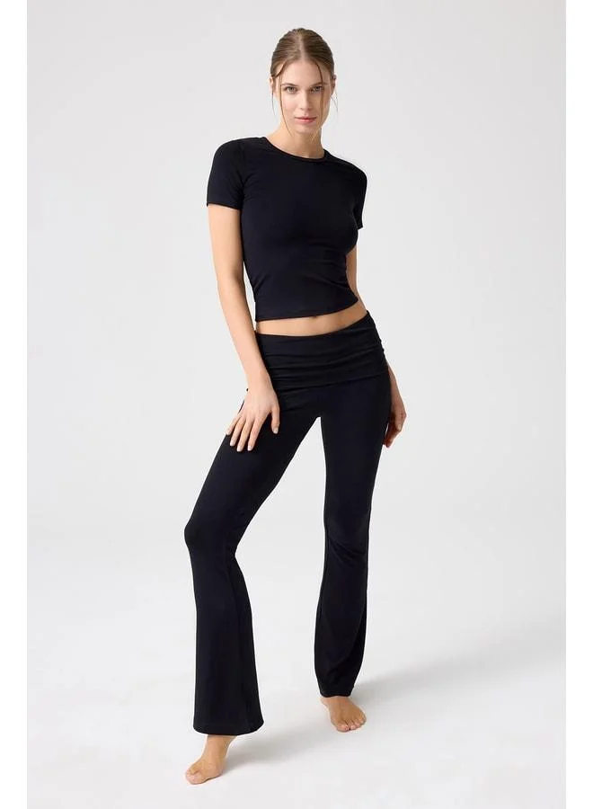 Los Ojos x Melodi Black Spanish Cuff Jersey Flared Pants.