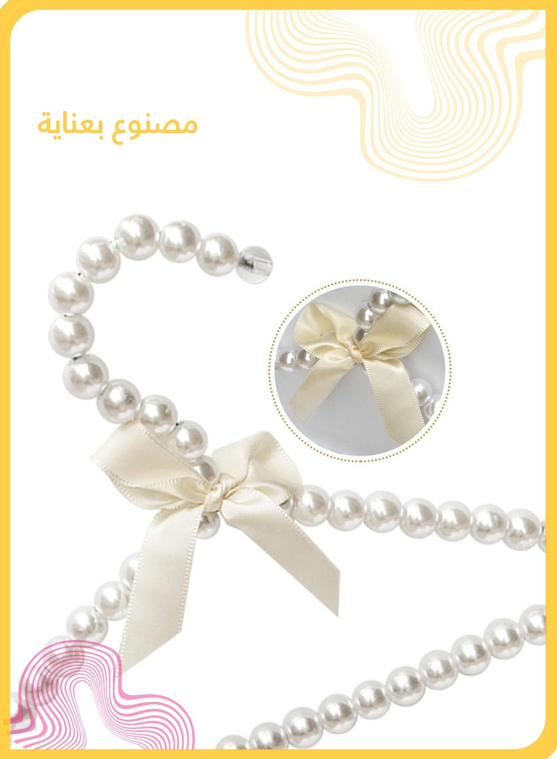 شي آند ليتل ٥ قطع شماعات لؤلؤية صغيرة للأطفال مع فيونكة، شماعات مضادة للانزلاق للفساتين وملابس الأطفال، تشطيب لؤلؤي ABS ناعم، مثالية للمنزل أو عرض البوتيك (أبيض) - Image 3