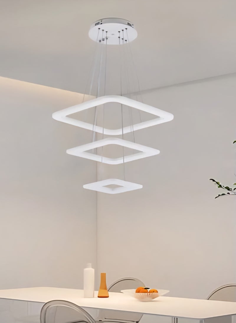 الثريات ثريا بتصميم هندسي يتكون من حلقات LED مربعة ب3 ألوان متدرجة،معلقة بأسلاك رفيعة تمنح الإحساس بالخفة والإنسيابية،تضفي هذه الثريا لمسة فنية ساحرة على المساحات الداخلية،مثالية  لغرفة المعيشة وغرفة الطعام مع جهاز تحكم عن بعد  - Image 3