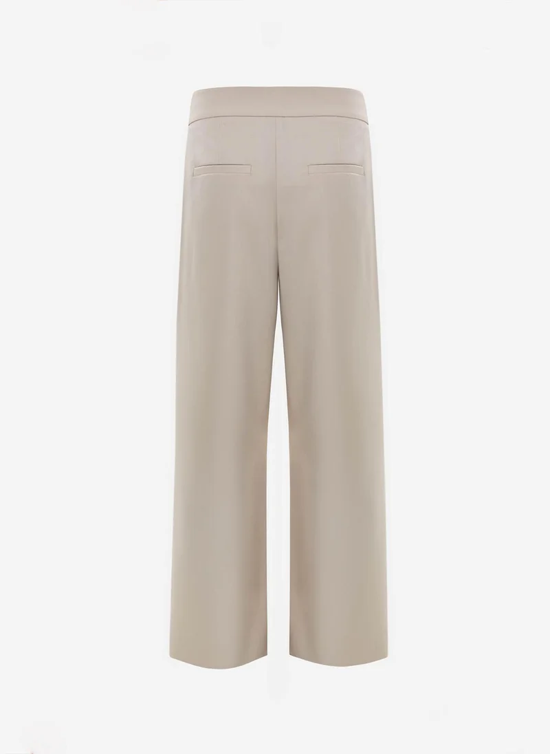 Lichi  Loose-fit trousers with asymmetrical fastening for Women | Best Price UAE