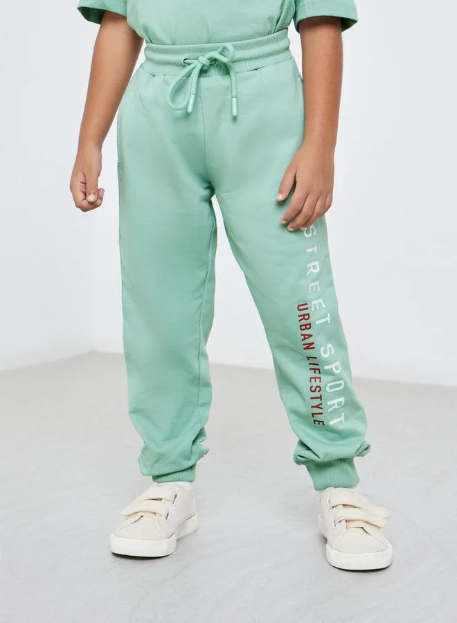 Styli Styli Boys Green Slogan Oversized T-Shirt and Joggers Set