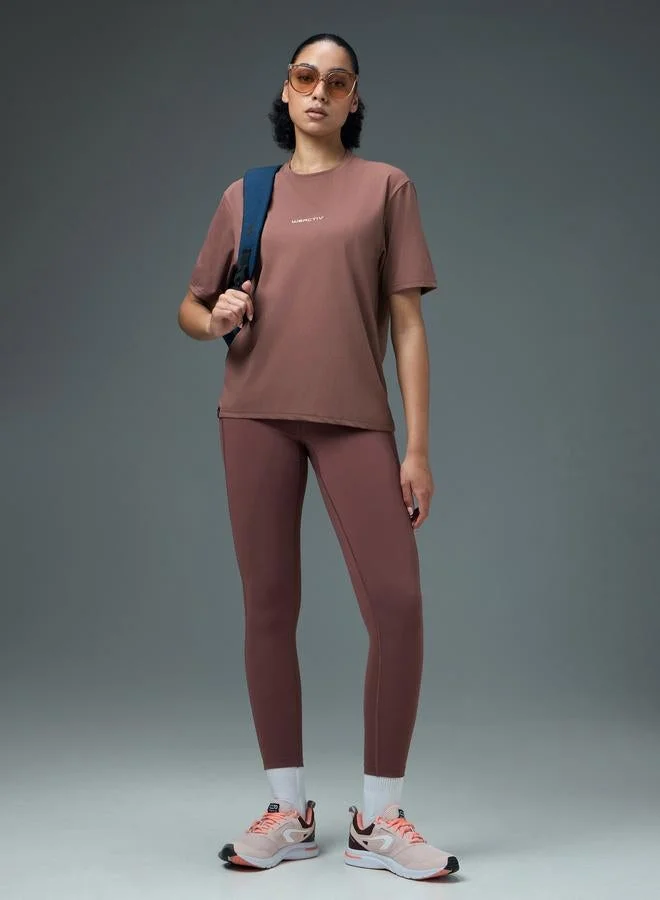 تكنوسبورت تيشيرت رياضي بياقة دائرية وقصة بوكسي للنساء