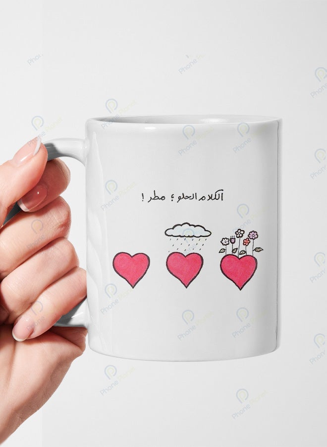 A ceramic mug printed with the phrase Sweet words are like rain and featuring a comfortable handle