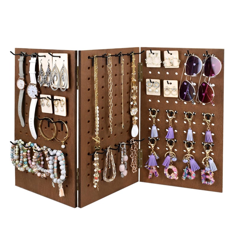 MOOCA Wall-Mountable Wooden Foldable 3-Panel Pegboard Jewelry Display Organizer with 48 Removable Black Hooks, Vertical or Horizontal Display, Ideal for Travel, Brown Color - Image 1
