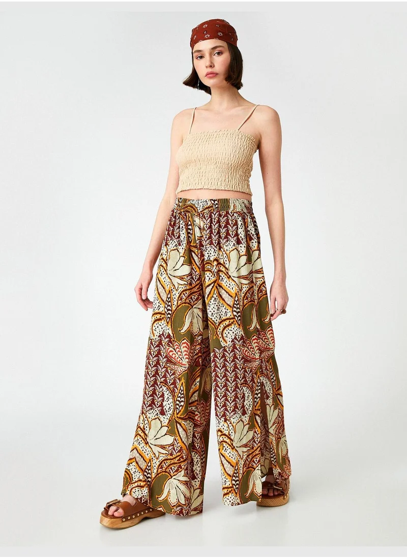 KOTON High Waist Patterned Flared Trousers