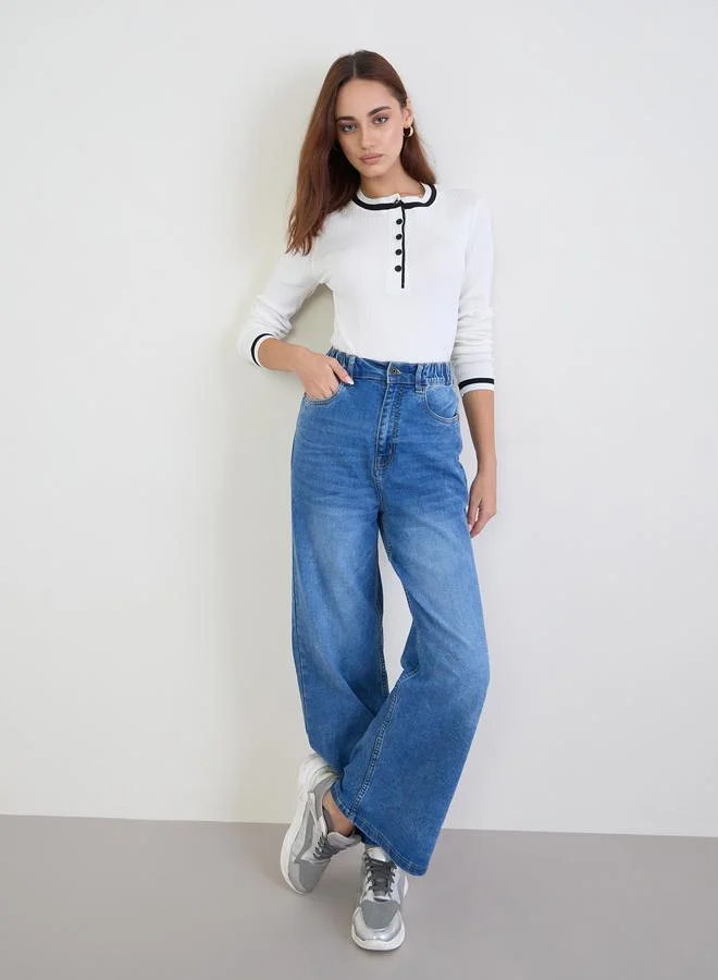 ستايلي بلوزة محبوك مضلع بلون أوف وايت مع حواف سوداء