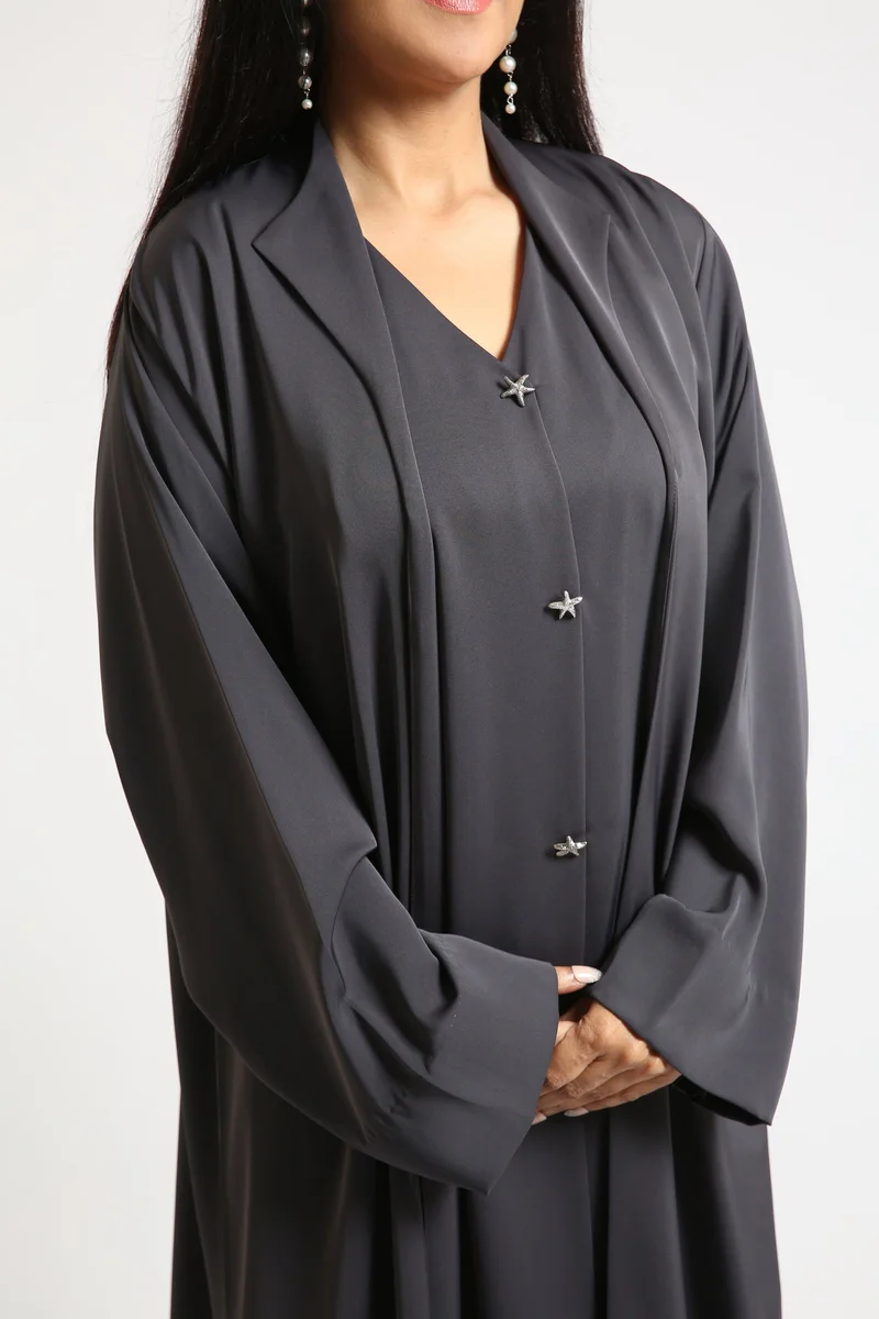 Nikias Grey nida abaya with collar and button and coat style look with very light weight and cuts