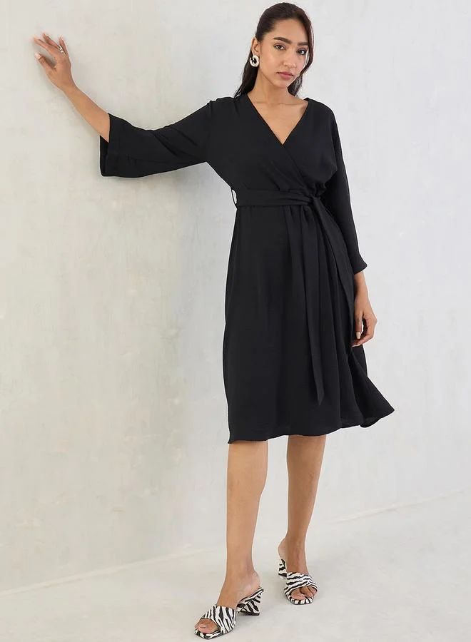 Femmella  Femmella Black Wrap Front Midi Dress with Tie Belt for Women | Best Price UAE