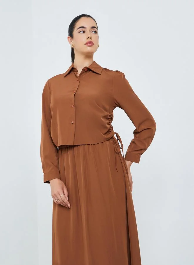 أميرة طقم من قميص مزموم وتنورة طويلة محتشم