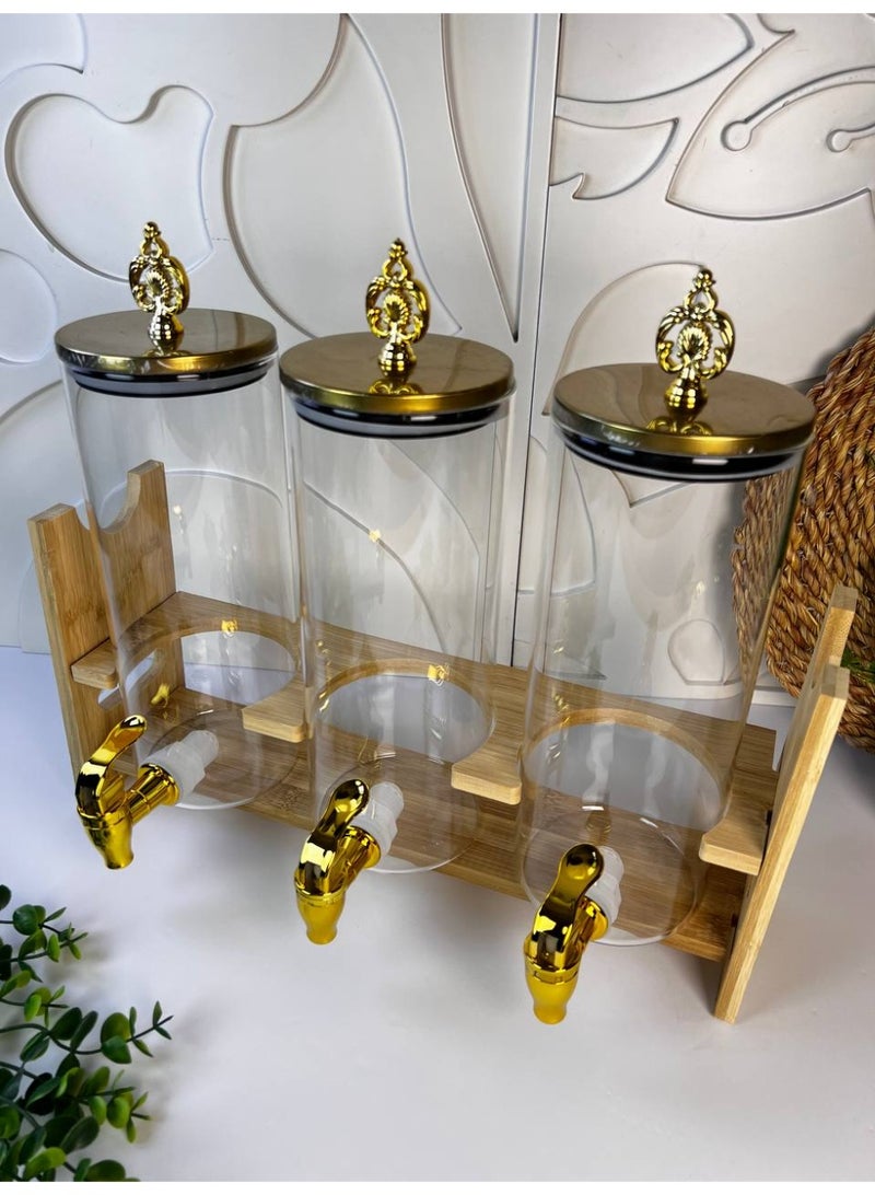 A very stylish wooden glass dispenser with three glass bottles on a wooden stand with a gold plastic handle and a sturdy, unbreakable plastic spout. Perfect for juices, water, and other delicious drinks. Each bottle holds approximately 1.5 liters. - Image 1