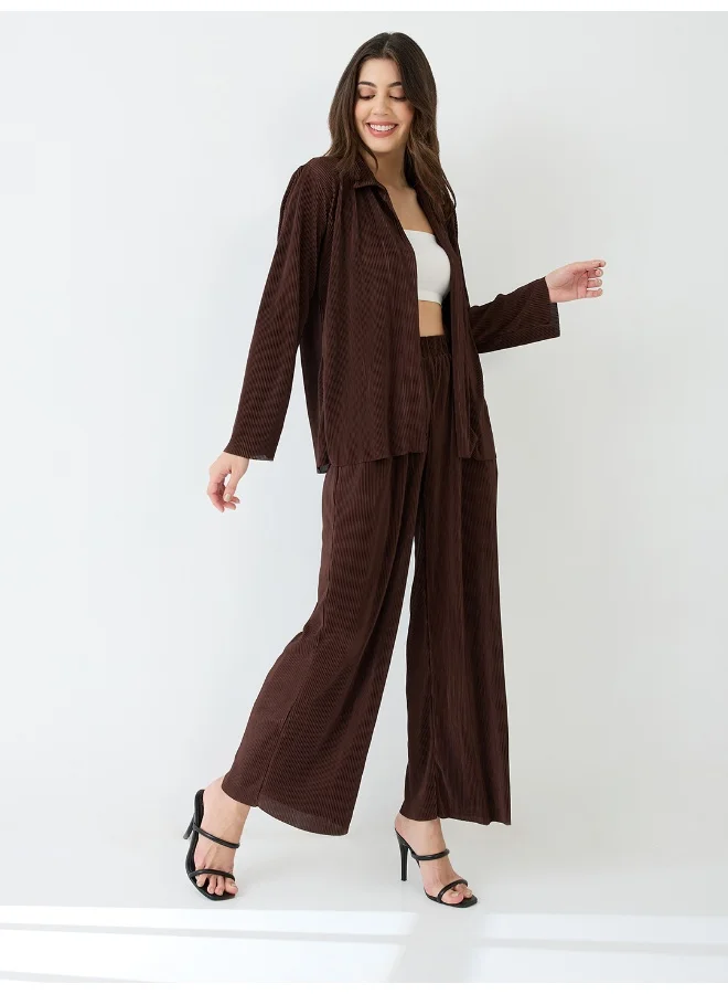 جلو باص طقم بلوزة نسائية مطوية مع بنطلون واسع الأرجل مطوي من جلوبس