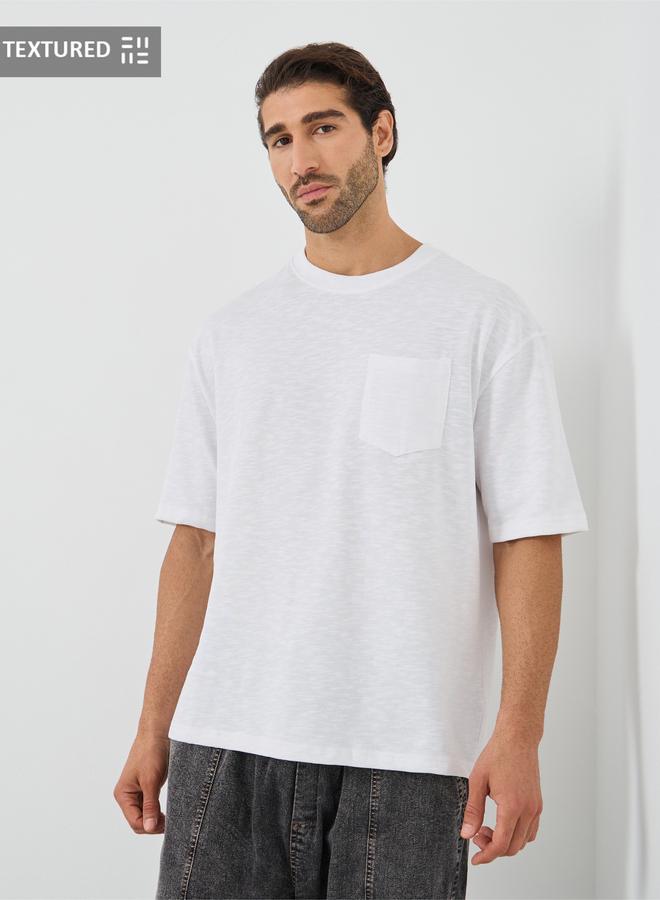 Styli Crew Neck Textured Oversized T-Shirt with Chest Pocket - Image 1