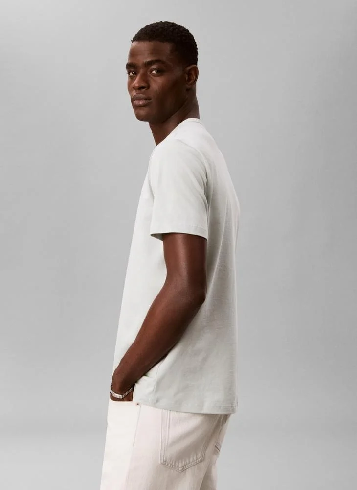 Calvin Klein Jeans Pale Meadow Linear Logo Crew Neck T-Shirt for Men | Best Price UAE