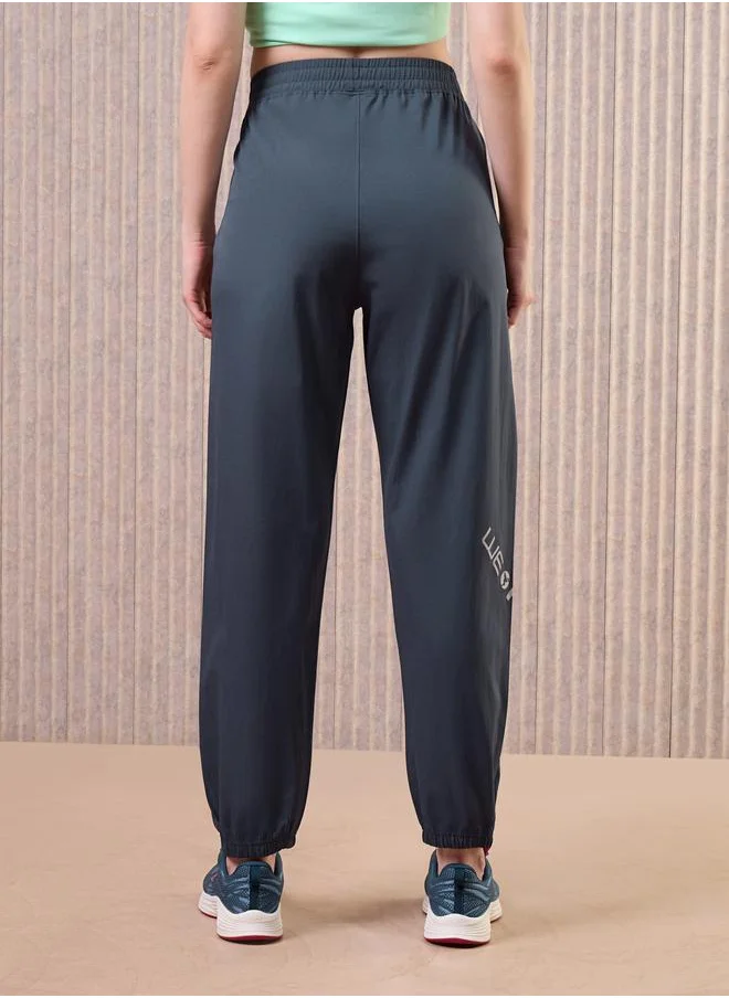 Technosport Technosport Women Grey Solid 2-Way Stretch Joggers