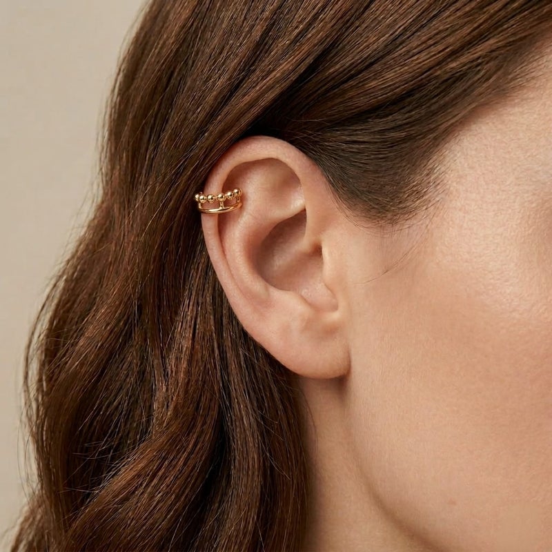 These distinctive gold earrings feature a row of prominent beads for an elegant and unique look. They require no piercing for easy wear and all-day comfort. - Image 2