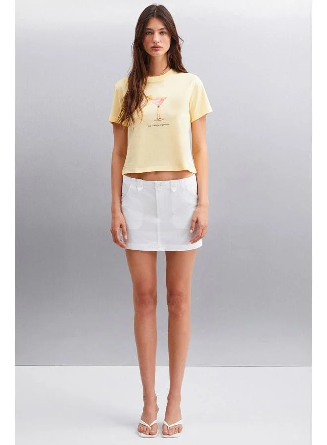 GRIMELANGE Ivonne Women's Cocktail Print Design Short Sleeve Organic Cotton Bike Neck Crop Yellow T-shirt.