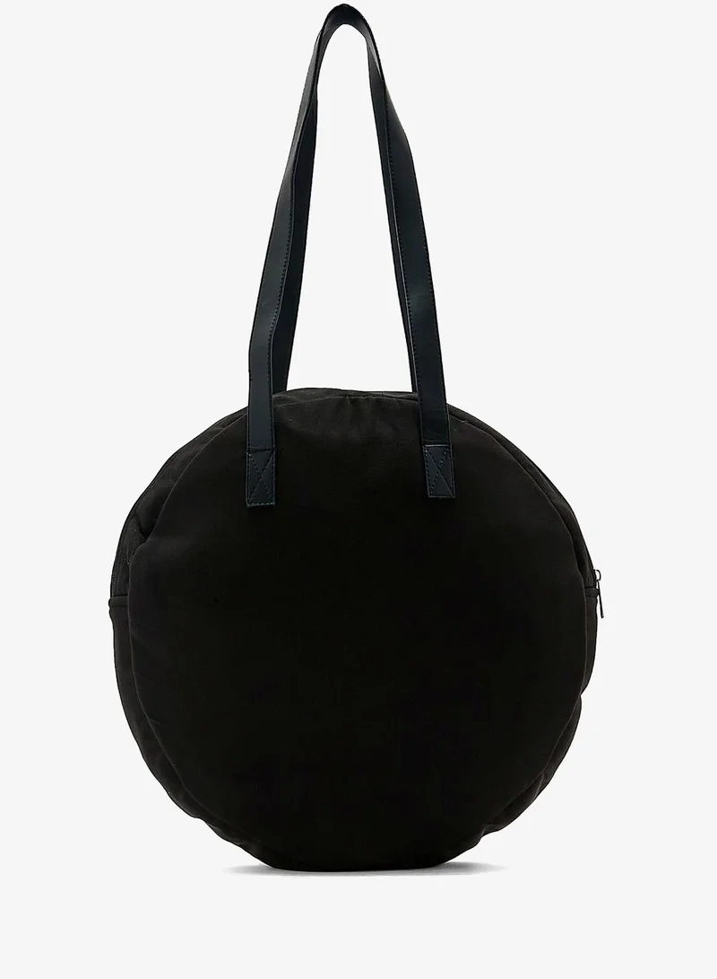 آيرا شنطة مستديرة من الخيش