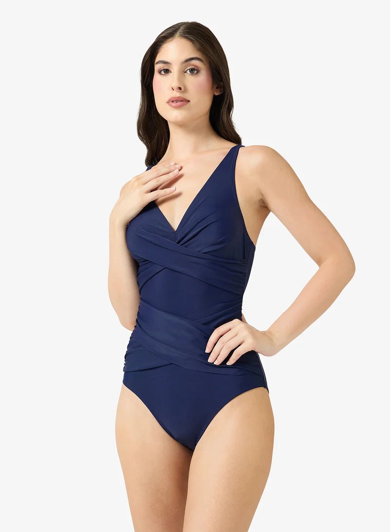 ايلا Ruched Swimsuit With Plunge Neckline