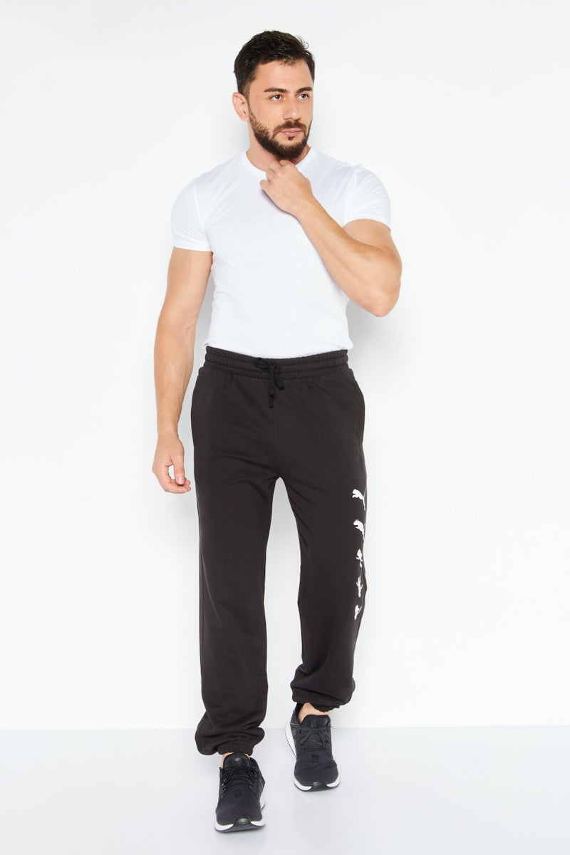 PUMA Men Regular Fit Graphic Printed Sweatpants, Black - Image 2