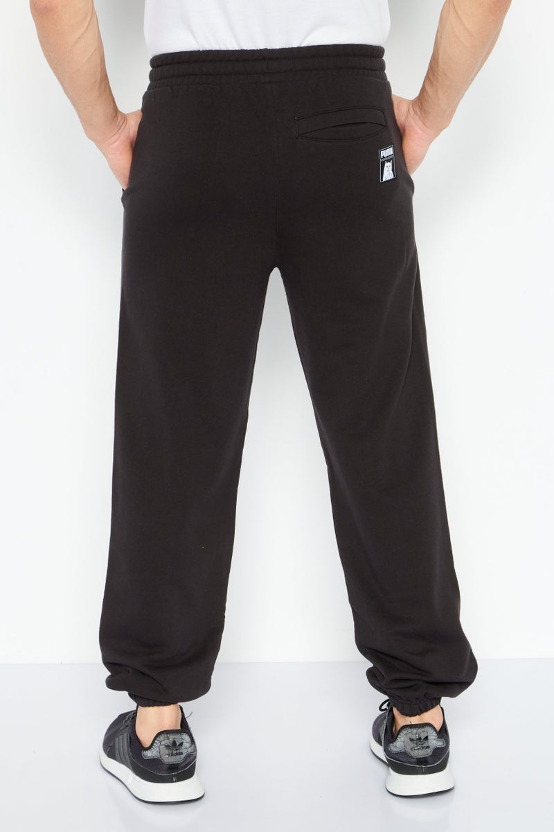 PUMA Men Regular Fit Graphic Printed Sweatpants, Black - Image 4