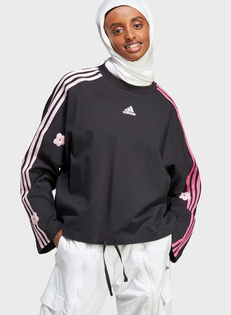 adidas سويت شيرت بطبعة زهرة وخطوط الماركة