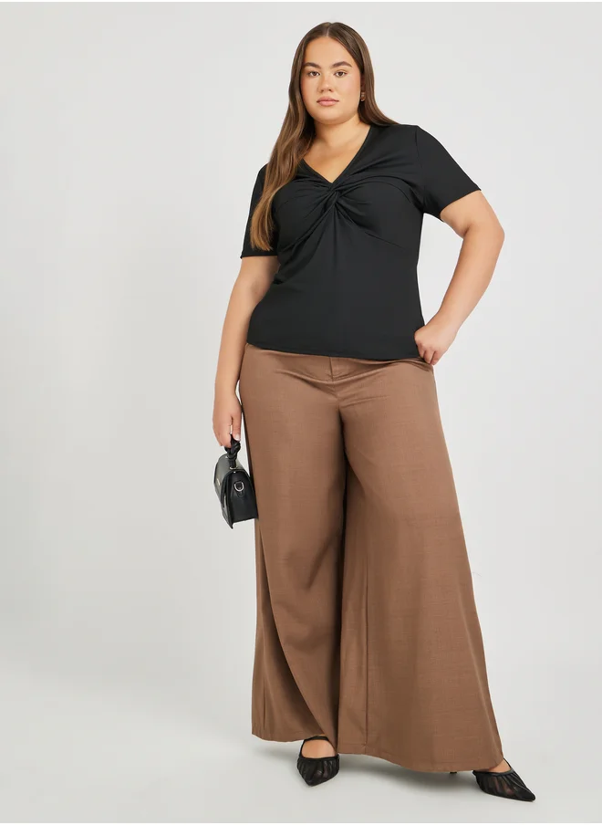 ستايلي Plus Size Textured Twisted Front T-Shirt