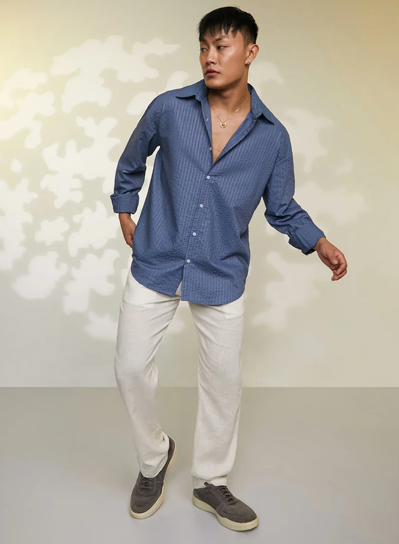 Campus Sutra Campus Sutra Men's Lapis Blue Candy-Textured Shirt For Casual Wear | Spread collor | Long Sleeve | Button Closure | Shirt Crafted With Comfort Fit For Everyday Wear