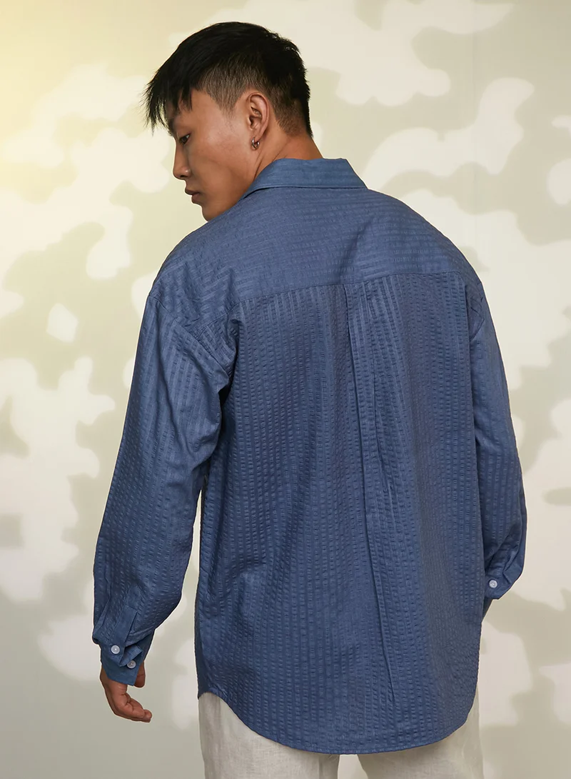 Campus Sutra Campus Sutra Men's Lapis Blue Candy-Textured Shirt For Casual Wear | Spread collor | Long Sleeve | Button Closure | Shirt Crafted With Comfort Fit For Everyday Wear