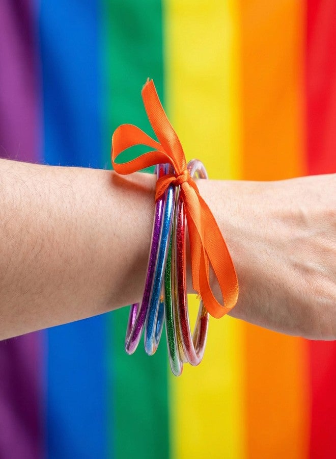 RunNico 10 Pcs Pride Month Jelly Bangles, Rainbow LGBTQ Jelly Bangles with Bowknot, 5 Colors Glitter Filled Bracelets for Pride Themed Party Parades Favors Costume Accessories - Image 3