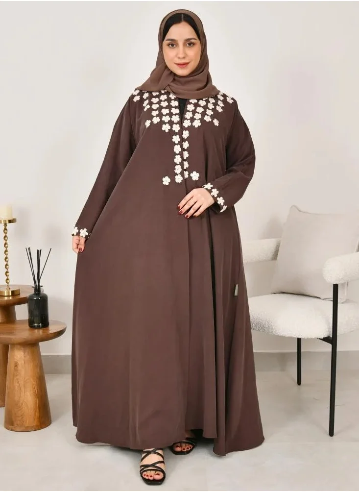 lamha abaya Elegant quarter-cloche abaya in brown with prominent white embroidery on the sides of the abaya and sleeves