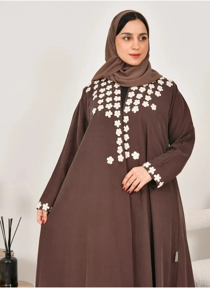 lamha abaya Elegant quarter-cloche abaya in brown with prominent white embroidery on the sides of the abaya and sleeves