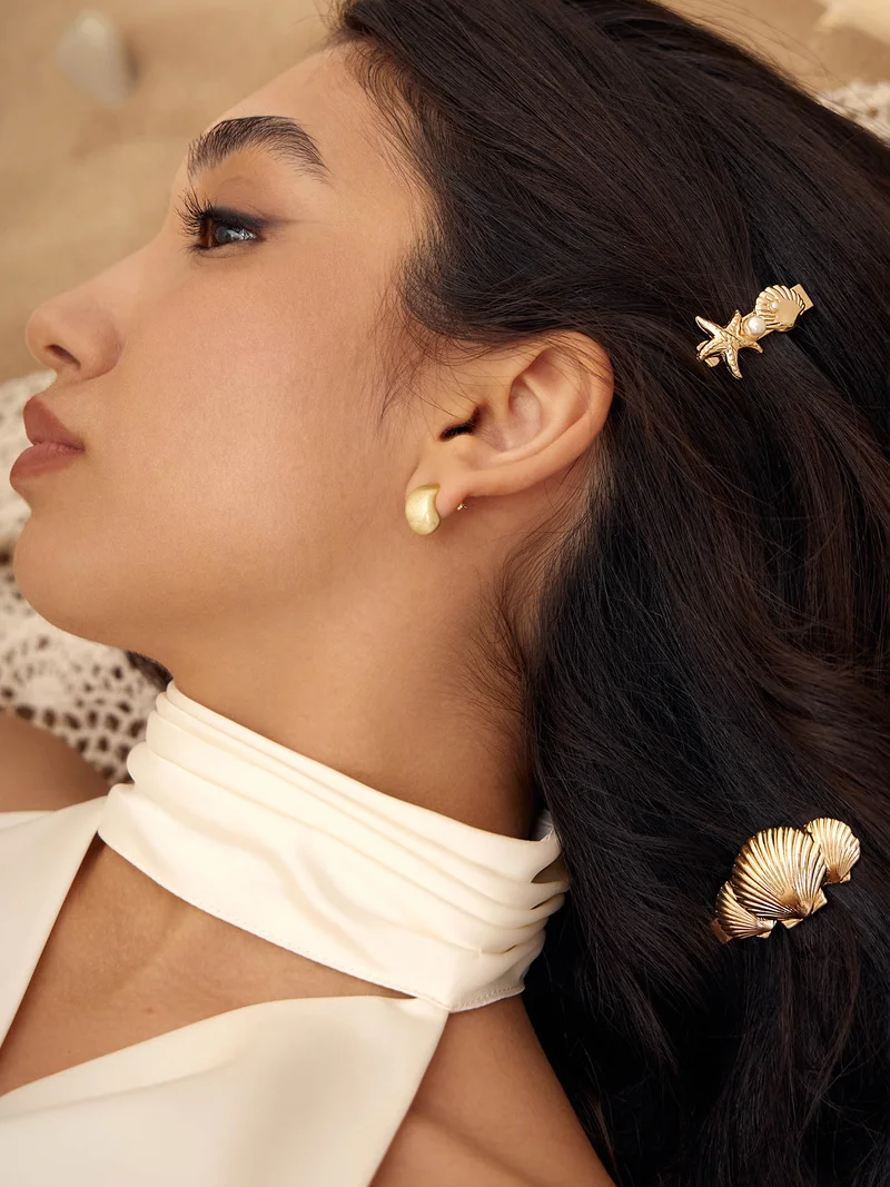 ليتشي مشبك شعر ذهبي بديكور بحري