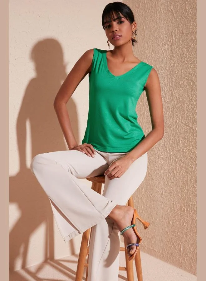 ليلا بلوزة نسائية بياقة على شكل حرف  وأحزمة عريضة