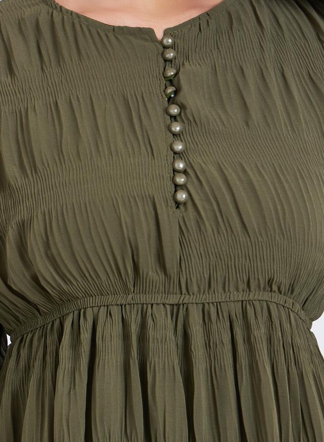 نسيج مُحبب بتفاصيل مُجمعة، طول الركبة بنصف أزرار