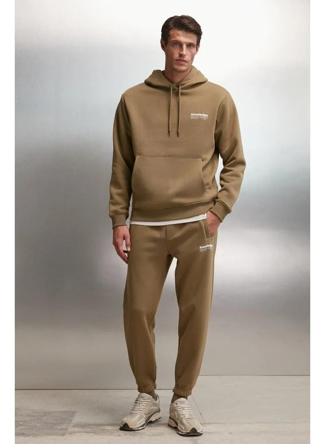 GRIMELANGE Bernon Men's Ultra-Soft Elastic Narrow-Leg Three-Pocket Organic Cotton Khaki Tracksuit Bottom.