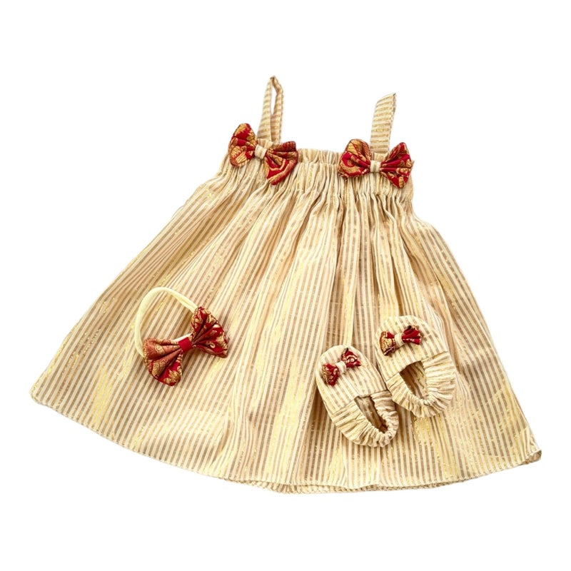 Picksparrow Baby Girl Fit And Flare Knee-Length Cotton Dress-Headband-Booties/Namakarana Set (Cotton-Lurex) (0-3 Months, Gold - Elastic Neck) - Image 5