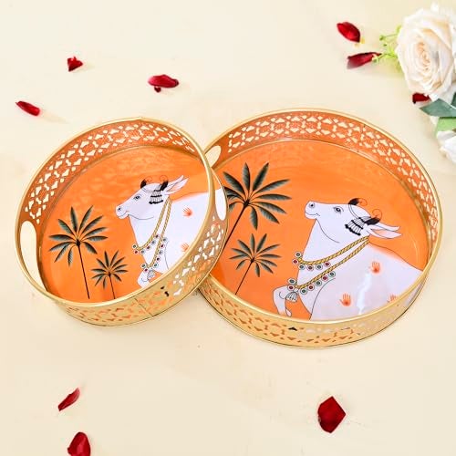 CraftVatika Pichwai Tray Set of 2 for Home Diwali Decorations Return Gifts, Cow Pichwai Metal Round Tray, Wedding Gifts, Home Decor Items, Orange - Image 1