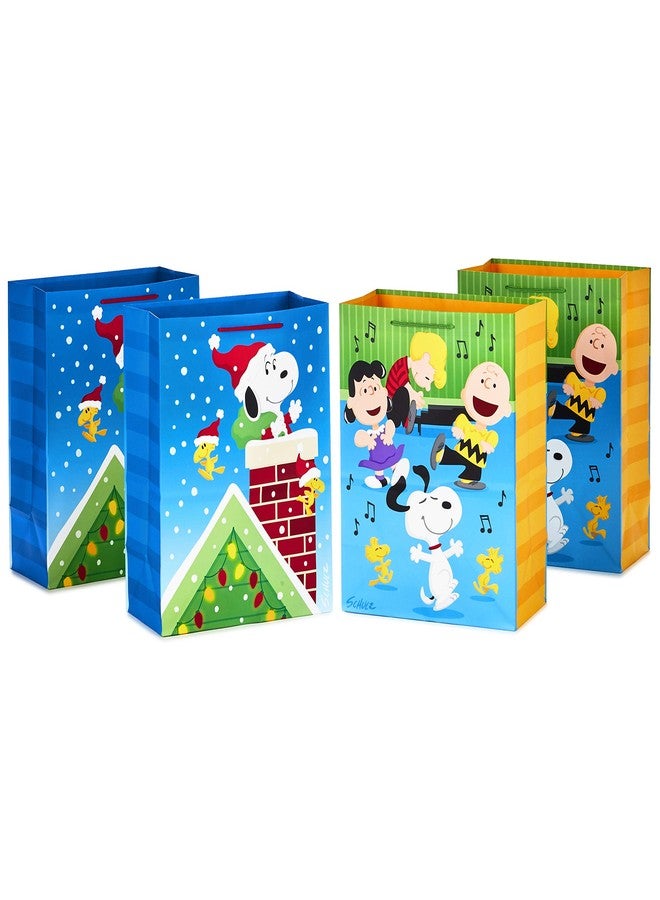 Hallmark Peanuts Christmas Gift Bag Bundle (4 Large 13" Gift Bags, 2 Designs) Snoopy, Woodstock, Charlie Brown and Friends - Image 1