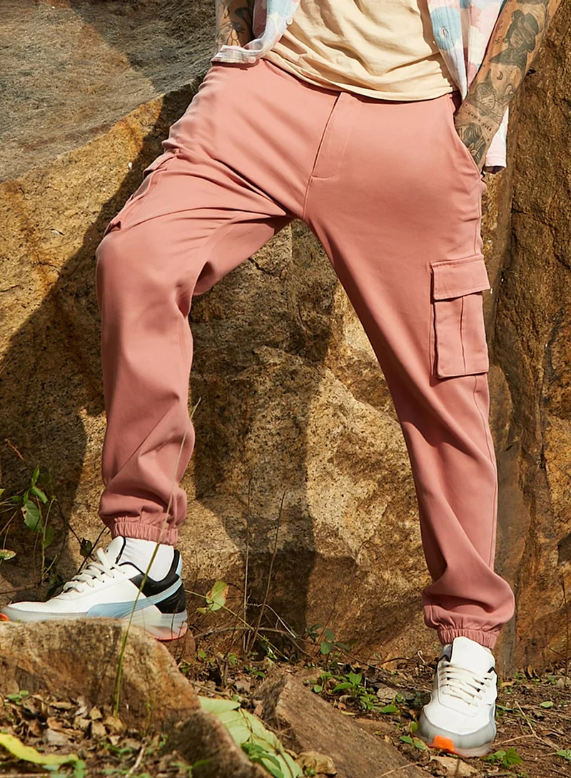 Campus Sutra Campus Sutra Men's Nude Pink Cuffed Hem Cargo Trousers For Casual Wear | 6 Pockets | Regular Fit | Button Closure | Cotton Poly Cargo Pant Crafted With Comfort Fit For Everyday Wear