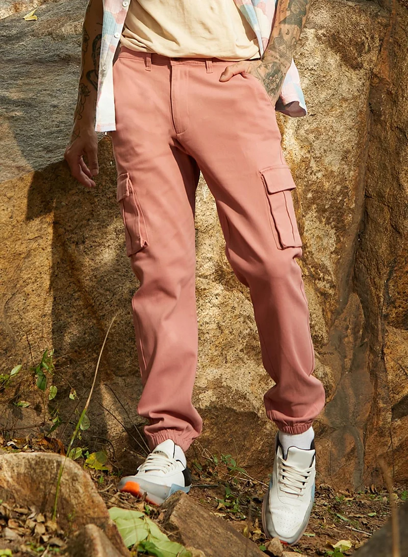 Campus Sutra Campus Sutra Men's Nude Pink Cuffed Hem Cargo Trousers For Casual Wear | 6 Pockets | Regular Fit | Button Closure | Cotton Poly Cargo Pant Crafted With Comfort Fit For Everyday Wear