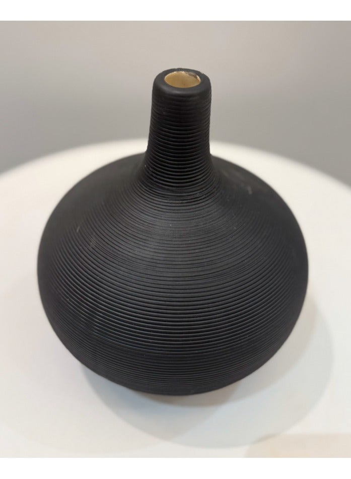 This black hand-sanded flower pot vase is crafted from durable resin with a beautifully cast design, perfect for displaying your favorite flowers or greenery. It makes a statement piece for your living room, bedroom, or dining room, reflecting your sophisticated taste. Dimensions: 20cm high x 17cm wide.  - Image 2