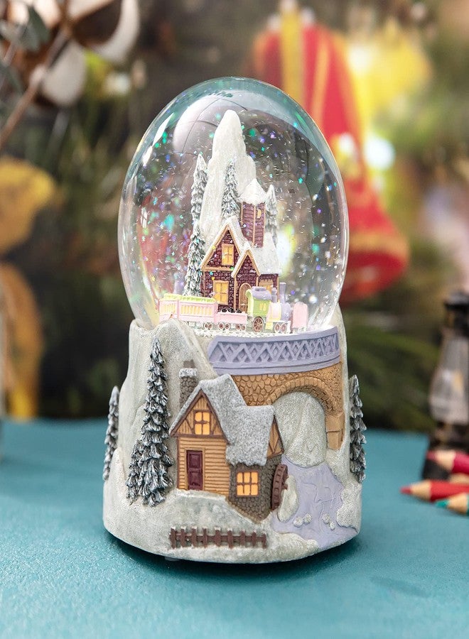 Juniland Castle Snowy House and Revolving Train Snow Globe Color Changing Lighting Snowglobe Plays Winter Wonderland (Castle and Train) - Image 3