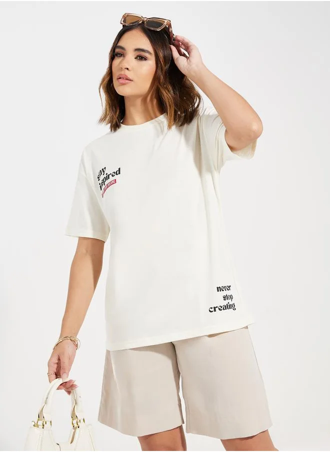 ستايلي Oversized Stay Inspired Slogan Dropped Shoulder T-Shirt