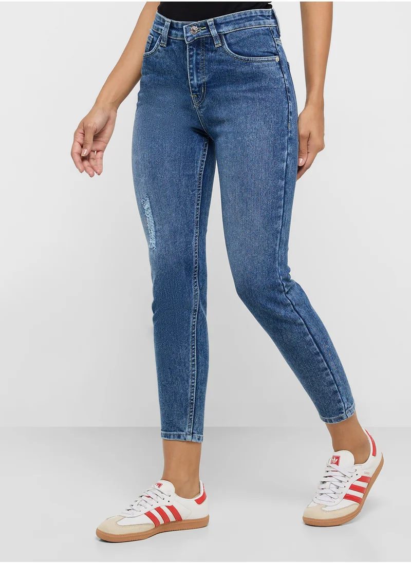 جينجر Distressed Mid Rise Skinny Jeans
