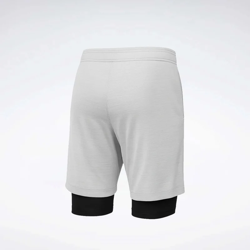ريبوك Maximize your workout with Reebok id Basketball 2-in-1 men's training Shorts. Engineered for performance, they offer freedom of movement and comfort.