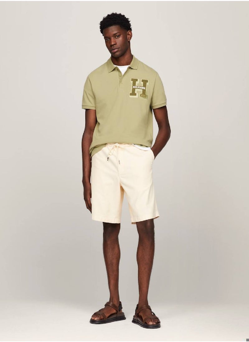 TOMMY HILFIGER - Men's Bouclé Logo Regular Fit Polo -  Pure cotton pique, Green - Image 1