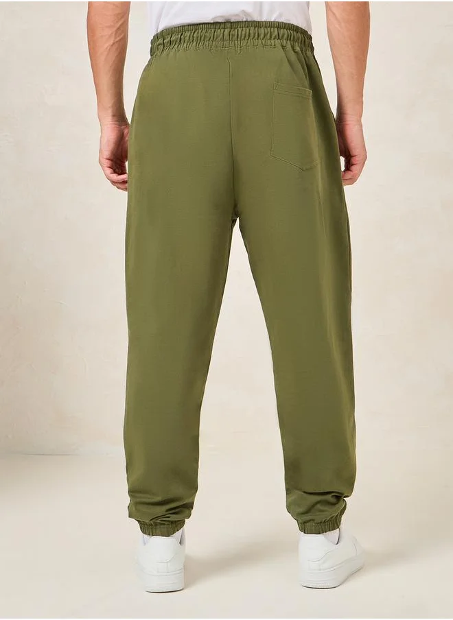 ستايلي Minimal Print Oversized Joggers with Elasticated Hem