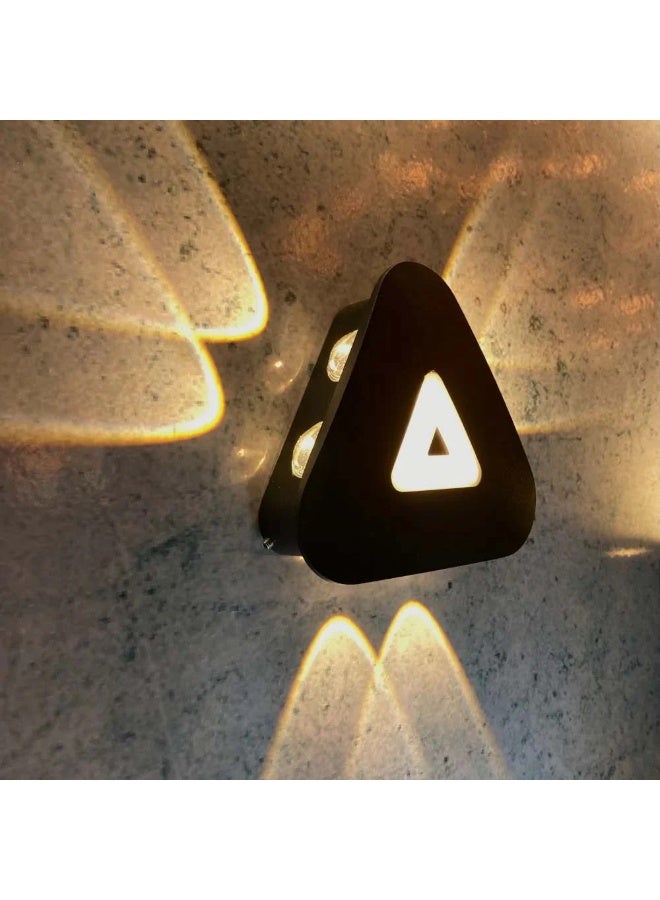 Modern black wall sconce (warm lighting) in the shape of a triangle - Image 2